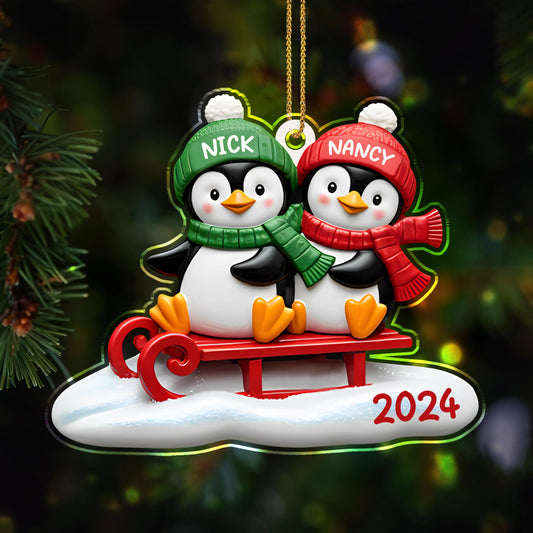 Waddle Into The Holiday Spirit Together With Penguins On A Sled