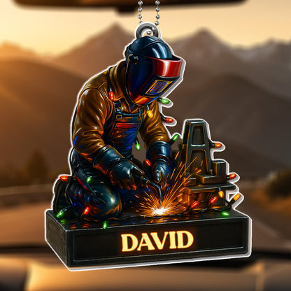 Skilled Welder At Work With Festive Lights
