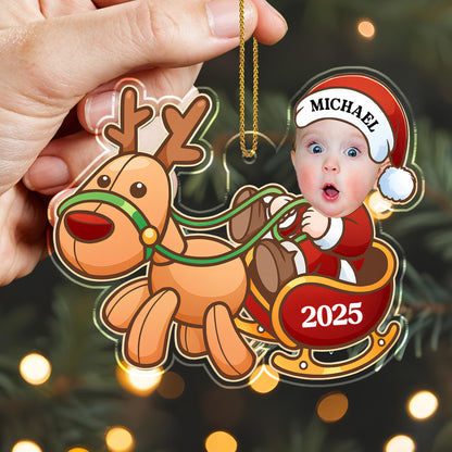 Charming Baby And Cheerful Reindeer In A Sleigh