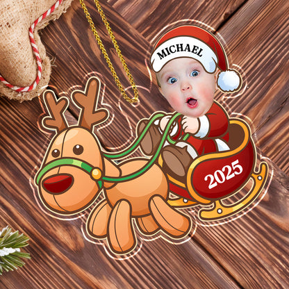 Charming Baby And Cheerful Reindeer In A Sleigh