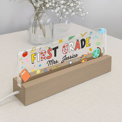 First Grade With Apple, Book, And Globe Design