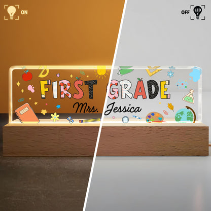 First Grade With Apple, Book, And Globe Design