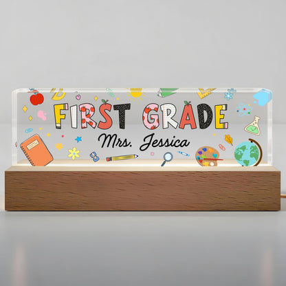 First Grade With Apple, Book, And Globe Design