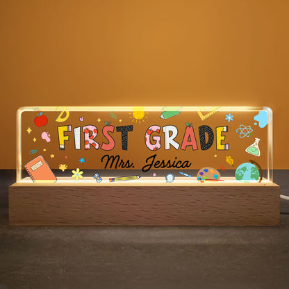 First Grade With Apple, Book, And Globe Design